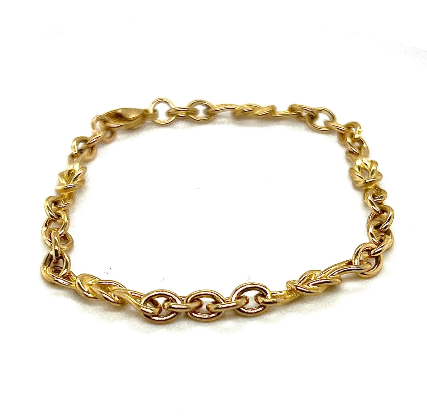 A 9k yellow gold reef knot bracelet with a linked chain design.