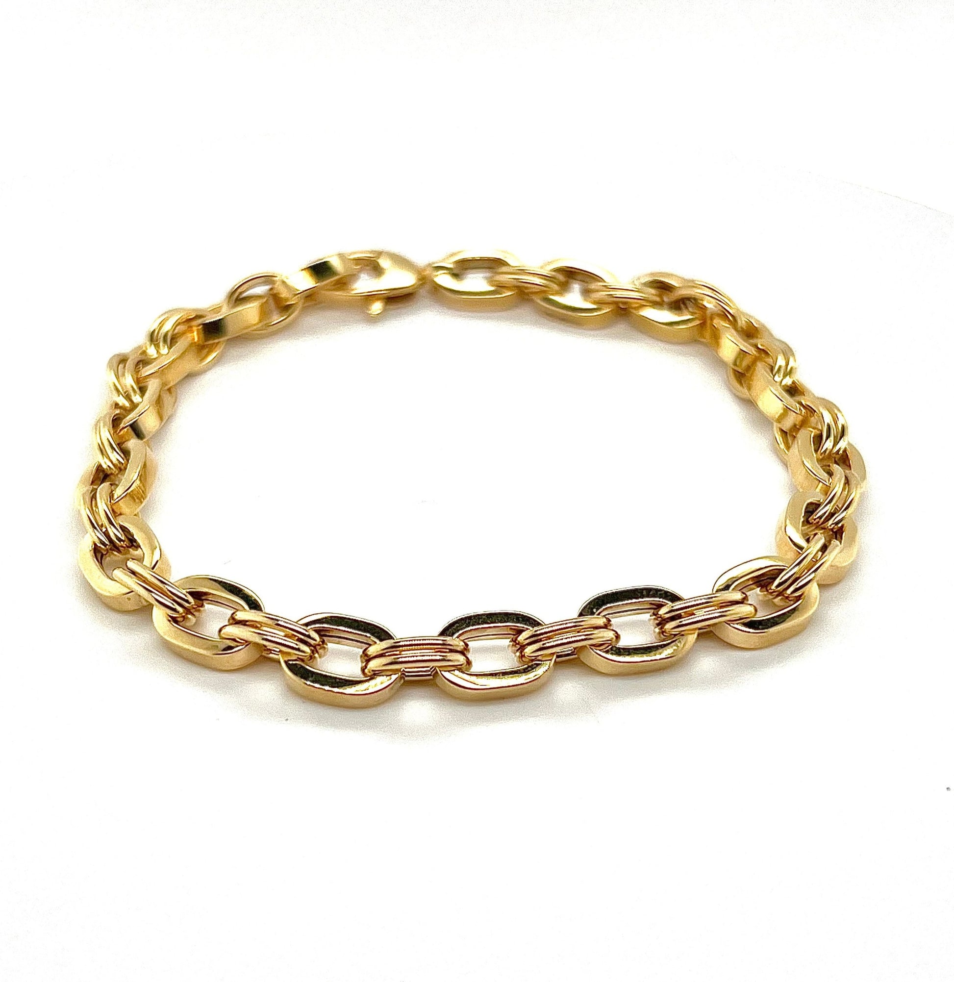 A 9K yellow gold oval link bracelet on a white background.