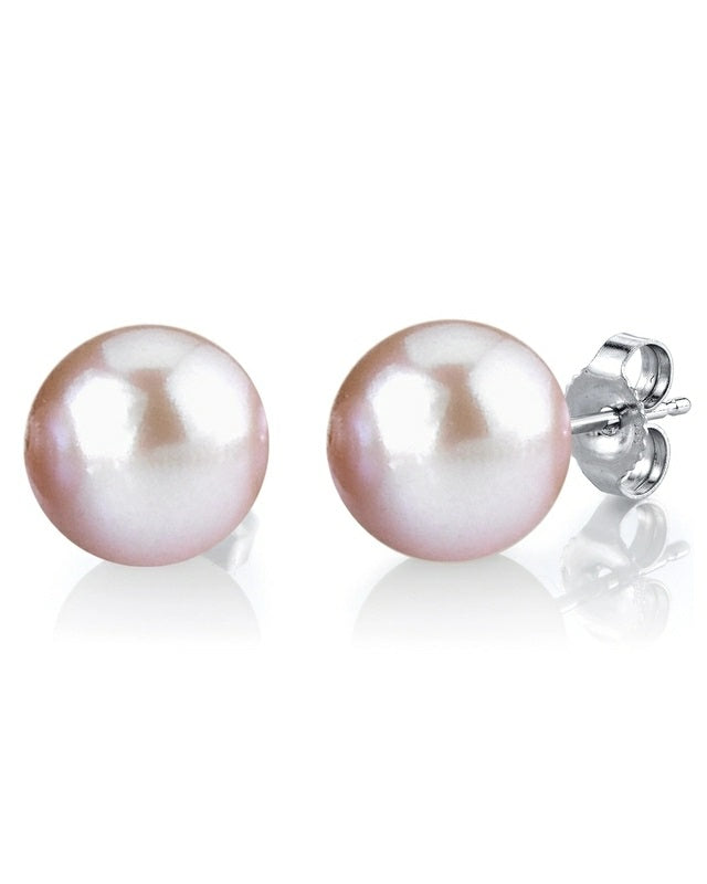 A pair of 18k white gold pink pearl stud earrings with pushback closures.