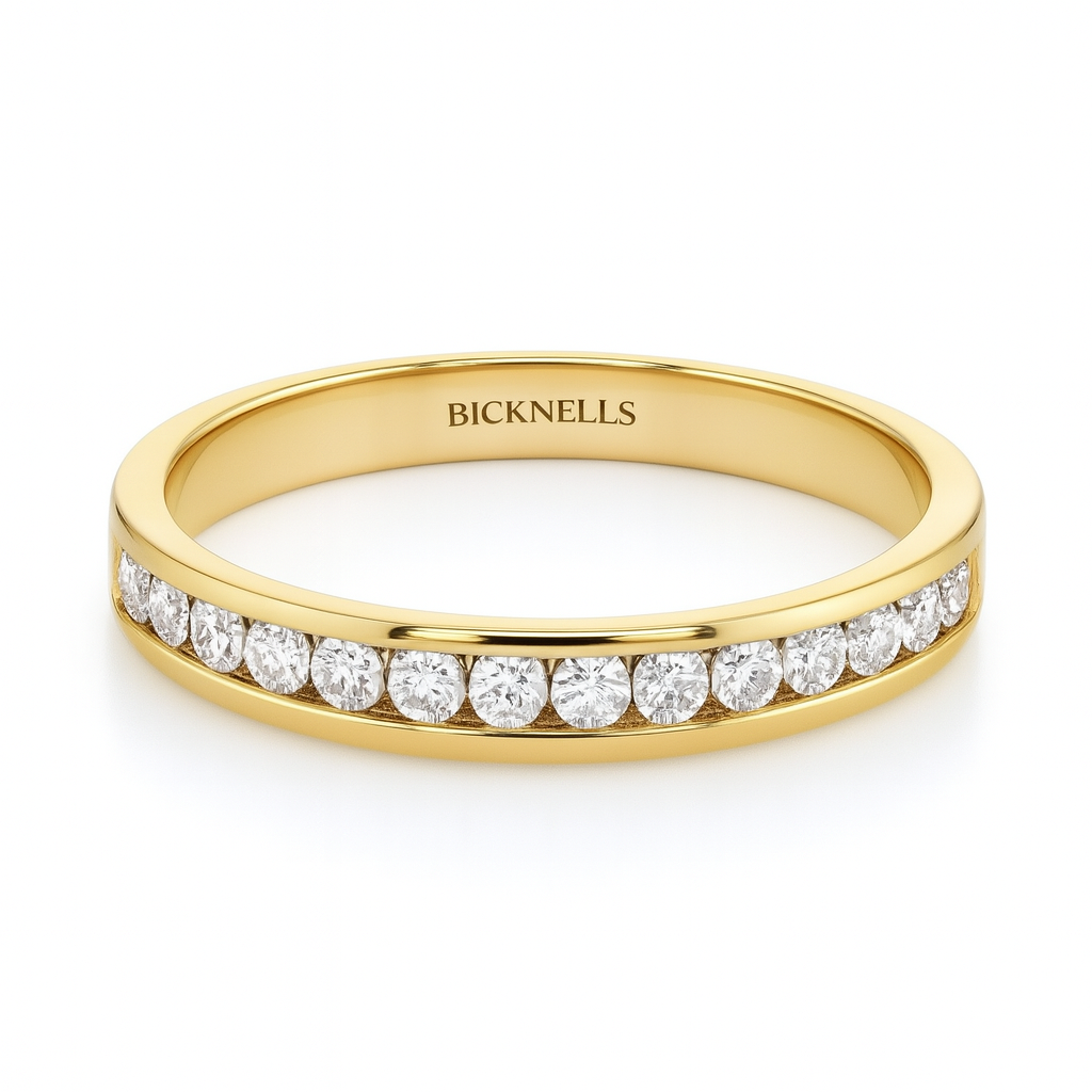 Gold ring with diamonds on a white background, branded 'Bicknells'.