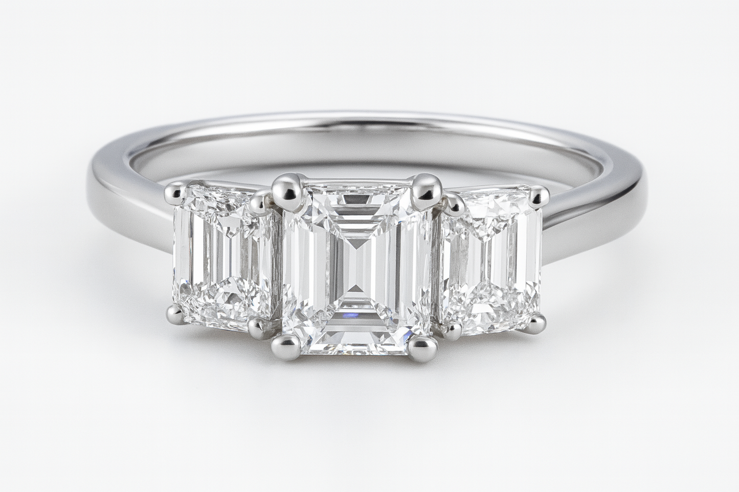 Platinum 1.91ct Emerald Cut Trilogy Ring
