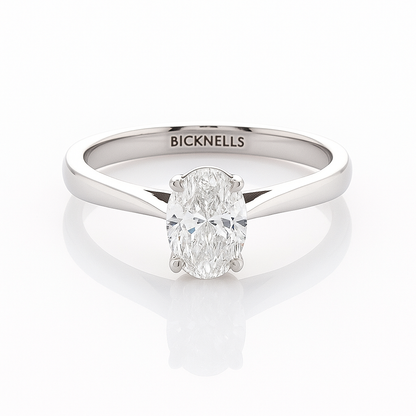 A Platinum 0.90ct Oval Cut Engagement Ring with a D/VS2 color and clarity certified by GIA, featuring a clear, well-cut oval diamond in a classic six-prong setting.