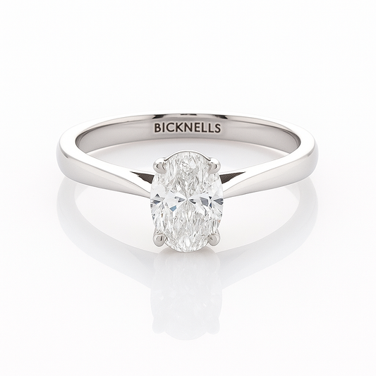 A Platinum 0.90ct Oval Cut Engagement Ring with a D/VS2 color and clarity certified by GIA, featuring a clear, well-cut oval diamond in a classic six-prong setting.