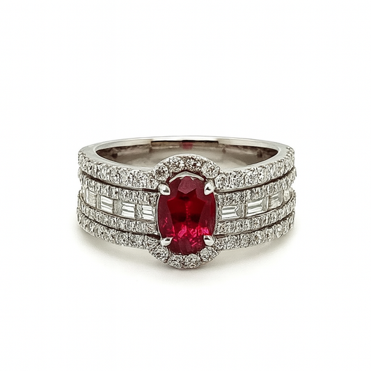 Ring with a central red gemstone and diamond accents on a white background
