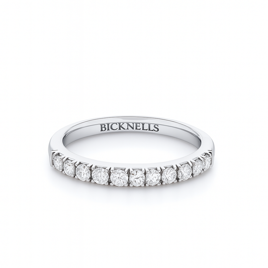 Diamond eternity ring claw set with round diamonds