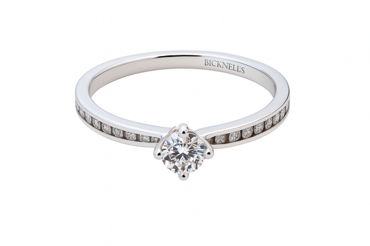 Diamond ring with 'Bicknells' engraving on a white background