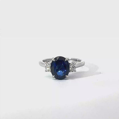 Platinum Oval Cut Blue Sapphire Trilogy Ring